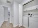 Light and bright hallway with laundry closet at 7606 Acklins Rd, Kissimmee, FL 34747