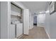 Well-lit laundry room with washer and dryer at 7606 Acklins Rd, Kissimmee, FL 34747