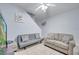 Living room with gray couches, a flat-screen TV, and a ceiling fan at 7606 Acklins Rd, Kissimmee, FL 34747