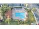 Community pool with lounge chairs and shaded areas at 7606 Acklins Rd, Kissimmee, FL 34747