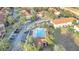 Community pool area with surrounding landscaping at 7606 Acklins Rd, Kissimmee, FL 34747