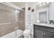 Clean bathroom with granite countertop vanity and shower at 8891 Geneve Ct, Kissimmee, FL 34747