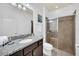 Clean bathroom with granite countertop and walk-in shower at 8891 Geneve Ct, Kissimmee, FL 34747