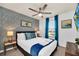 Bright bedroom with a queen-size bed, tasteful decor, and large window at 8891 Geneve Ct, Kissimmee, FL 34747