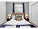 Bright bedroom with a king-size bed and two nightstands at 8891 Geneve Ct, Kissimmee, FL 34747