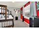 Bunk beds in a ' bedroom with red walls and superhero theme at 8891 Geneve Ct, Kissimmee, FL 34747