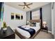Spacious bedroom with a comfortable queen-size bed and stylish decor at 8891 Geneve Ct, Kissimmee, FL 34747