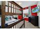 ' bedroom with bunk beds, red walls, and a TV at 8891 Geneve Ct, Kissimmee, FL 34747