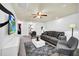 Spacious Gathering room with comfy seating and ceiling fan at 8891 Geneve Ct, Kissimmee, FL 34747
