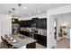 Modern kitchen with granite countertops and breakfast bar at 8891 Geneve Ct, Kissimmee, FL 34747