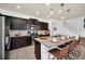 Updated kitchen featuring dark cabinetry and granite countertops at 8891 Geneve Ct, Kissimmee, FL 34747