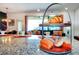 Island kitchen with granite countertop and breakfast bar at 8891 Geneve Ct, Kissimmee, FL 34747