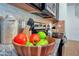 Kitchen detail with wood bowl filled with fruit at 8891 Geneve Ct, Kissimmee, FL 34747