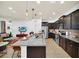Spacious kitchen with large island and stainless steel appliances at 8891 Geneve Ct, Kissimmee, FL 34747