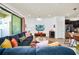 Comfortable living room featuring a large sectional sofa and flat-screen TV at 8891 Geneve Ct, Kissimmee, FL 34747