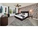 Main bedroom with king-size bed and decorative wall at 8891 Geneve Ct, Kissimmee, FL 34747