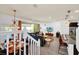 Open concept main living area including kitchen, living room, and dining area at 8891 Geneve Ct, Kissimmee, FL 34747