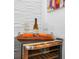 Built-in wine cooler with wine and glasses at 8891 Geneve Ct, Kissimmee, FL 34747