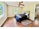 Spacious bedroom with wood flooring and large window at 110 Oleander Ave, Auburndale, FL 33823