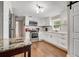 Updated kitchen featuring granite countertops at 110 Oleander Ave, Auburndale, FL 33823