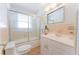 Bathroom with a tub/shower combo and updated vanity at 136 Reef Rd, South Daytona, FL 32119
