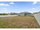Large backyard with grassy area and privacy fence at 1917 Michigan Drive, Poinciana, FL 34759