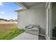 Cozy patio with a wicker bench, perfect for relaxing at 1917 Michigan Drive, Poinciana, FL 34759