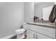 Clean bathroom with granite countertop and white cabinets at 1917 Michigan Drive, Poinciana, FL 34759