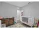 Bedroom with crib and dresser, ready for a new baby at 1917 Michigan Drive, Poinciana, FL 34759