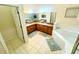 Bathroom with double sinks, corner bathtub, and a separate shower at 210 Watling Way # 24-210, Davenport, FL 33897