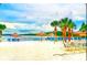 Relaxing beach area with lounge chairs and volleyball net at 210 Watling Way # 24-210, Davenport, FL 33897