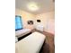 Charming bedroom with two twin beds, dresser, and wall art at 210 Watling Way # 24-210, Davenport, FL 33897