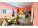 Combined living and dining area with wicker furniture at 210 Watling Way # 24-210, Davenport, FL 33897
