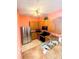 Kitchen with stainless steel appliances and wood cabinets at 210 Watling Way # 24-210, Davenport, FL 33897