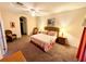Main bedroom with king-size bed and access to the bathroom at 210 Watling Way # 24-210, Davenport, FL 33897