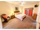 Main bedroom with king-size bed and wicker furniture at 210 Watling Way # 24-210, Davenport, FL 33897