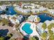 Aerial view of community pool and surrounding buildings at 2516 Woodgate Blvd # 206, Orlando, FL 32822