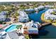 Aerial view of community pool and waterfront homes at 2516 Woodgate Blvd # 206, Orlando, FL 32822