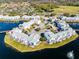 Aerial view of the property highlighting its waterfront location and community at 2516 Woodgate Blvd # 206, Orlando, FL 32822