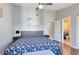 Main bedroom with king-size bed and en-suite bathroom at 2516 Woodgate Blvd # 206, Orlando, FL 32822