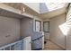 Building entrance with stairs and exterior siding at 2516 Woodgate Blvd # 206, Orlando, FL 32822