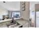 Kitchen features a breakfast bar overlooking the living room and water views at 2516 Woodgate Blvd # 206, Orlando, FL 32822