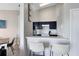 Modern kitchen with dark cabinetry, granite counters, and breakfast bar at 2516 Woodgate Blvd # 206, Orlando, FL 32822
