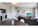 Living room with sofa, dining table and kitchen, has an open floor plan at 2516 Woodgate Blvd # 206, Orlando, FL 32822
