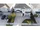 Two-story house, gray siding, three-car garage, paved driveway, and landscaping at 289 Auburn Ave, Kissimmee, FL 34747