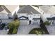 Two-story house with gray siding, three-car garage, and landscaping at 289 Auburn Ave, Kissimmee, FL 34747