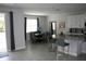 Bright dining area with seating for six, adjacent to the kitchen at 289 Auburn Ave, Kissimmee, FL 34747