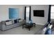 Spacious living room with comfortable sofas and large TV at 289 Auburn Ave, Kissimmee, FL 34747