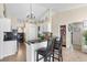 Open kitchen with an island and breakfast bar seating at 304 Jacksonville Ct, Kissimmee, FL 34759