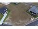 Large vacant lot between two homes in a new development at 326 Spinnaker Ct, Auburndale, FL 33823